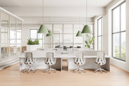 Modern open-plan office with ergonomic chairs and green pendant lights, on bright interior background. Office workspace concept.  3D Rendering