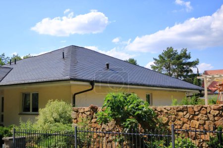 Photo for Roof of a house is newly covered with slate - Royalty Free Image
