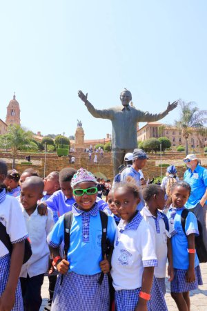 Photo for September 29 2022 - Pretoria, South Africa: Happy Children at the Nelson Mandela statue on his square in front of Union Buildings in Pretoria, South Africa - Royalty Free Image