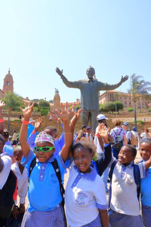 Photo for September 29 2022 - Pretoria, South Africa: Happy Children at the Nelson Mandela statue on his square in front of Union Buildings in Pretoria, South Africa - Royalty Free Image