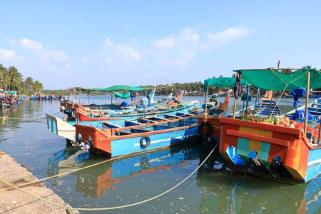 Photo for December 28 2022 - Kannur, Kerala in India: Fishing Harbour Palacode with colorful fishing boats after fishing at noon - Royalty Free Image