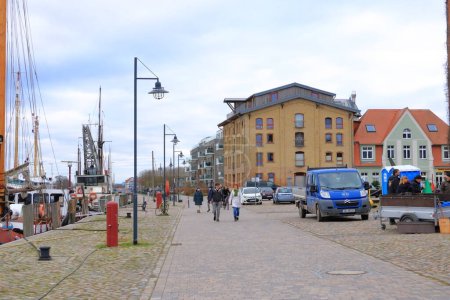 January 28 2023 - Greifswald in Germany: The harbor with wooden sailboats in historic city of Greifswald