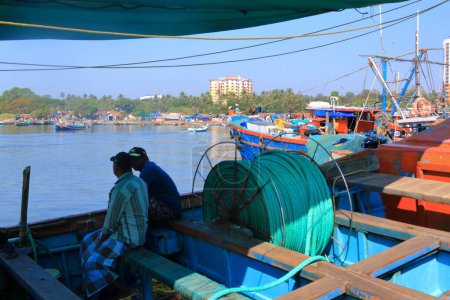 Photo for December 29 2022 - Kannur, Kerala, India: Fishing Harbour with colorful fishing boats after fishing in the morning - Royalty Free Image