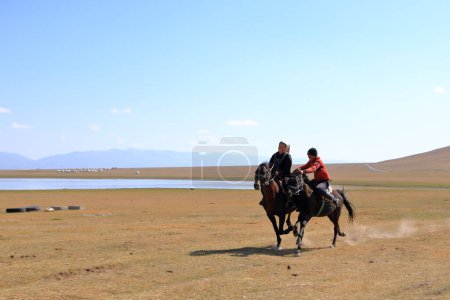 Photo for August 24 2023 - Song kol Lake in Kyrgyzstan: Performance of kyz kuuma (girl chasing), equestrian traditional sport - Royalty Free Image