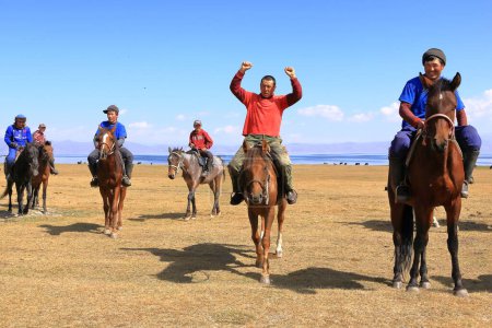 Photo for August 24 2023 - Song kol Lake in Kyrgyzstan: Locals play kok boru (ulak tartysh), traditional horse game, with leather dummy instead of a goat carcass - Royalty Free Image