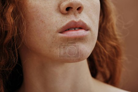Photo for Close-up of beautiful young woman face with freckles and no-makeup - Royalty Free Image