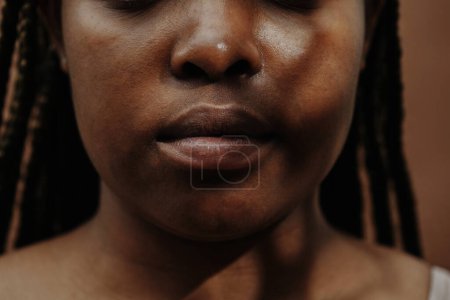 Photo for Close-up of African girl face with closed mouth - Royalty Free Image