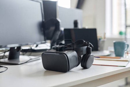 Photo for Close-up of virtual reality glasses lying on table of programmer in IT office - Royalty Free Image
