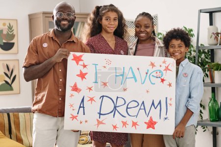 Photo for Happy Black family showing I have a dream placard they made - Royalty Free Image