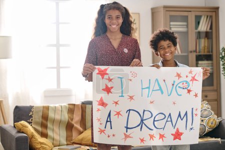 Photo for Portrait of smiling brother and sister holding I have a dream placard created for Martin Luther King Jr day - Royalty Free Image