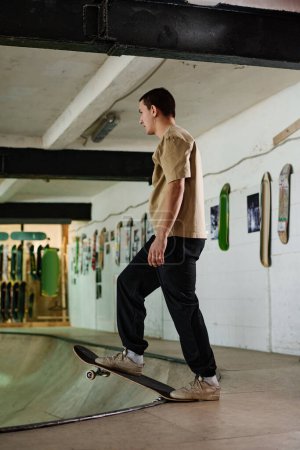 Vertical long shot of active young Caucasian guy getting ready to perform trick while training skateboarding in skatepark