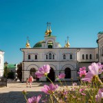 Spring landscape with pink flowers and refectory church in Kyiv Pechersk Lavra