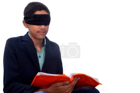 Photo for Handsome teenage school boy with blindfold reading book, isolated white background, Indecision and uncertainty conceptual - Royalty Free Image