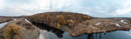Aerial autumn panorama of golden Siverskyi Donets river valley landscape in Ukraine