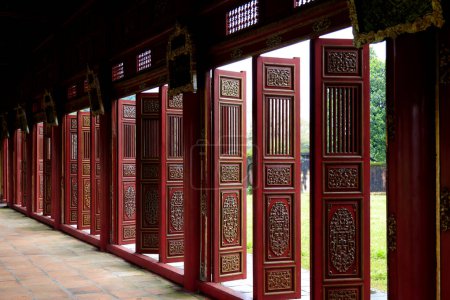 Adjustable doors of an ancient palace of the Imperial Citadel of Hue. High quality photo