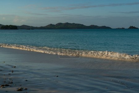 Téléchargez les photos : View of Curieuse Island in the evening from Anse Volbert on the Seychelles island of Praslin. - en image libre de droit