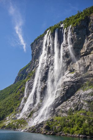 The Seven Sisters waterfall gets its name from, the seven separate streams, the tallest measures 250 meters. The waterfall is located at Geirangerfjord between Geiranger and Hellesylt. 