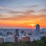 Tokyo, Japan, June 13, 2024: The sun sets behind the cityscape of Tokyo, Japan during a summer day. The skies above filled with golden and red hues from the sunset at dusk. 
