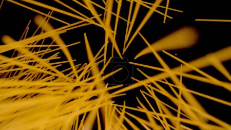 Téléchargez les photos : Abstract view of falling spaghetti scattered on black background. Famous Italian pasta ready for cooking and preparing delicious meal. Dropped raw spaghetti sheaf in shallow focus. - en image libre de droit
