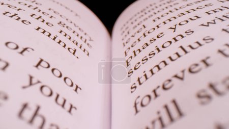 Téléchargez les photos : CLOSE UP, BOKEH: Detailed view of printed page text in an open book. Words and paragraphs of the open handbook in shallow focus. book sheet details with written content forming pattern. - en image libre de droit