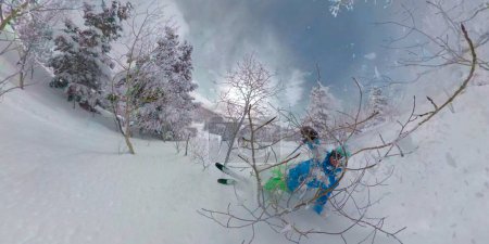 Photo for SELFIE: Active male tourist on fun skiing trip crashes while tree skiing in Deer Valley, Utah. Funny shot of a cross-country skier slamming into the champagne powder while skiing in American mountains - Royalty Free Image