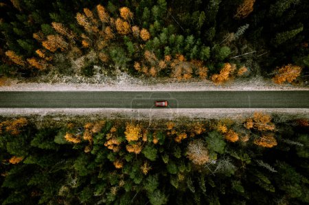 Photo for Aerial view of fall road with autumn woods and first snow in Finland, Lapland - Royalty Free Image