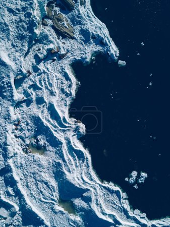 Photo for Aerial view of lake or sea ice formations in Finland. Cracked Ice from drone view. Background texture concept. - Royalty Free Image