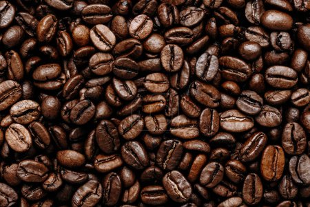 Téléchargez les photos : Des grains de café. Café torréfié grains de fond, vue de dessus - en image libre de droit