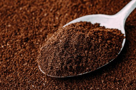 Photo for Ground coffee in spoon close-up. Food background - Royalty Free Image