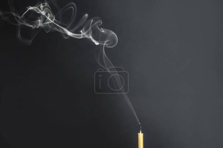 Photo for Church candle with smoke. - Royalty Free Image