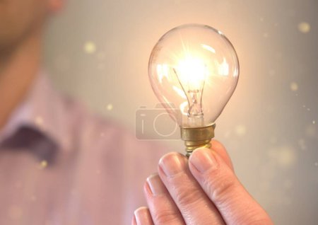 Person holding a light bulb suggesting an idea