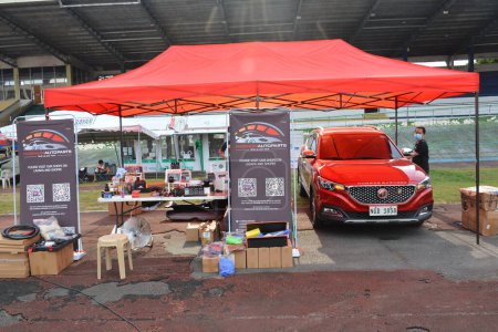 Téléchargez les photos : QUEZON CIY, PH - MAY 14 - Magnum autoparts booth at G fest car show on May 14, 2022 in Quezon City, Philippines. G fest is a Geely car show held in Philippines. - en image libre de droit