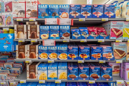 Photo for Italy - October 2023: Creams and puddings of various types and brands packaged displayed on shelves for sale in Italian supermarket. Elah, Cameo and lindt puddin - Royalty Free Image