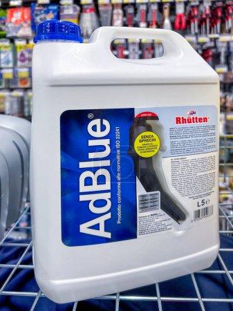 Photo for Italy - February 10, 2024: AdBlue urea-based solution in Rhutten brand packaging important Italian chemical industry -solution for emission reduction in diesel engines - Royalty Free Image