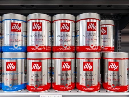 Photo for Italy - February 17, 2024: Illy ground coffee in tin cans displayed on shelves for sale in Italian supermarket - Royalty Free Image