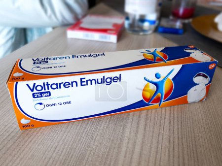 Photo for Turin, Italy - March 07, 2024: Voltaren Emulgel anti-inflammatory drug with active ingredient diclofenac sodium in package on wooden table - Royalty Free Image