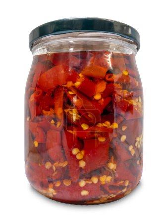 Chilies cut in oil in glass jar isolated on white with clipping path included