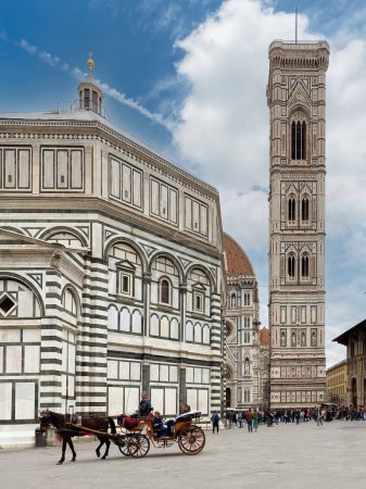 Photo for Florence, Italy - April 04, 2024: Piazza San Giovanni with horse carriage for tourists near the baptistery and with Giotto's bell tower in the backgroun - Royalty Free Image