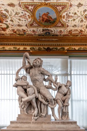 Photo for Florence, Italy - 05 April 2024: Laocoon group by Bandinelli 1520 displayed in the Uffizi Gallery in the west corridor under ceiling frescoed with grotesques - Royalty Free Image