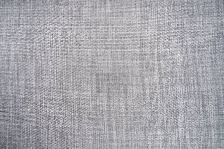 Photo for Gray background fabric texture. A piece of woolen cloth is neatly laid out on the surface. Weave and textile texture. Dress fabric or for kitchen needs, tablecloth or curtains, close-up. Dash. - Royalty Free Image