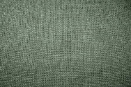 Photo for Green background fabric texture. A piece of woolen cloth is neatly laid out on the surface. Weave and textile texture. Dress fabric or for kitchen needs, tablecloth or curtains, close-up. Dash. - Royalty Free Image