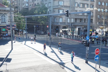 Photo for Belgrade, Serbia, 9.9.2023 Pride protest march entry point Slavia Square towards Nemanjina Street. Start of The Pride march. Police cordon in the Belgrade center. LGBT festival. People are walking. - Royalty Free Image
