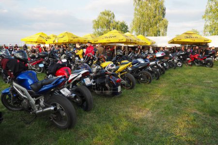 Photo for Sremska Mitrovica, Serbia, 04.29.23 Gathering or meeting of motorcyclists and bikers at a festival. People in leather clothes walk next to motorcycles. A motorcycle club. Bikerism as a subculture - Royalty Free Image