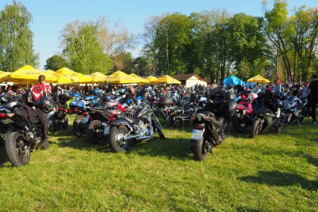 Photo for Sremska Mitrovica, Serbia, 04.29.23 Gathering or meeting of motorcyclists and bikers at a festival. People in leather clothes walk next to motorcycles. A motorcycle club. Bikerism as a subculture - Royalty Free Image