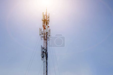 Telecommunication tower with sun background,cellular mobile pole communication technology.