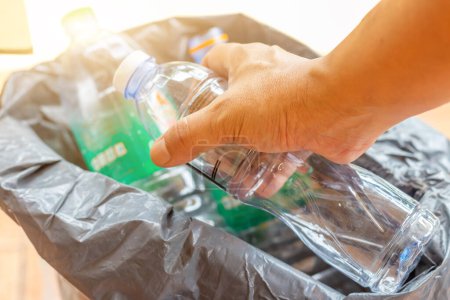 Photo for Hand hold old plastic bottles and containers set for recycling,Rubbish, rubbish, garbage, plastic waste, plastic waste pollutio - Royalty Free Image