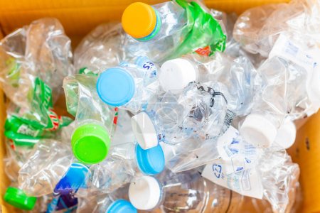 Photo for Hand hold old plastic bottles and containers set for recycling,Rubbish, rubbish, garbage, plastic waste, plastic waste pollutio - Royalty Free Image