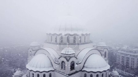 Photo for View of Saint Sava, orthodox church in Belgrade, Serbia in winter snowing time. - Royalty Free Image