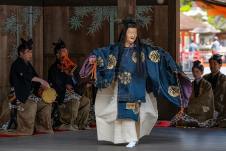 Photo for Hatsukaichi, Japan - April 17, 2023: Classical Japanese dance in the Itsukushima Shrine on Miyajima Island, Hiroshima Prefecture, Japan. - Royalty Free Image