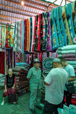 Photo for Bishkek, Kyrgyzstan - September 2, 2023: Carpet sellers in the Osh Bazaar in Bishkek, Kyrgyzstan. - Royalty Free Image